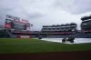 A message on the jumbotron announces the baseball game between the Detroit Tigers and the Washington Nationals is postponed due to weather at Nationals Park, Tuesday, July 1, 2025, in Washington. (AP Photo/Jess Rapfogel)