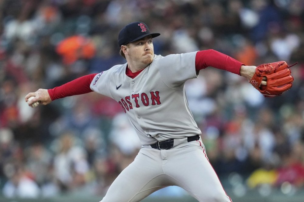 Boston Red Sox pitcher Hunter Dobbins throws against the San Francisco Giants during the first inning of a baseball game in San Francisco, Friday, June 20, 2025. (AP Photo/Jeff Chiu)