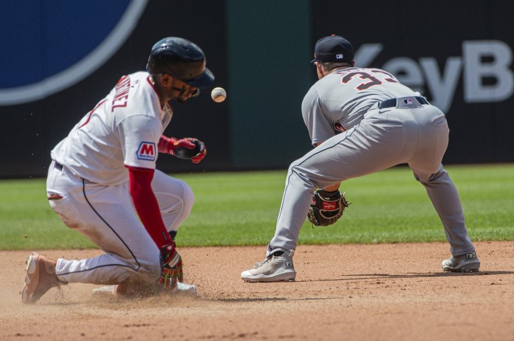 Cleveland Guardians' Angel Martinez, left, slides safely into second base as Detroit Tigers' Colt Keith waits for the throw during the seventh inning of a baseball game, Sunday, July 6, 2025, in Cleveland. (AP Photo/Phil Long)