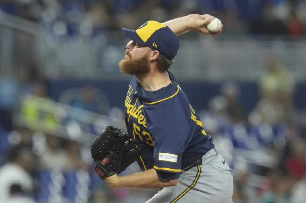 Milwaukee Brewers pitcher Brandon Woodruff aims a pitch during the second inning of a baseball game against the Miami Marlins, Sunday, July 6, 2025, in Miami. (AP Photo/Marta Lavandier)