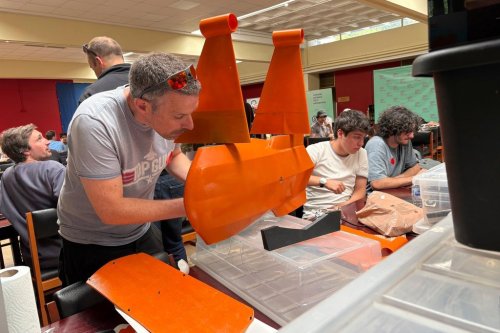 Participants gather for the London Defence Tech Hackathon, a weekend brainstorming solution for technical challenges, at the Royal Military Academy Sandhurst in Camberley, England, May 10, 2025. (AP Photos/Kelvin Chan)