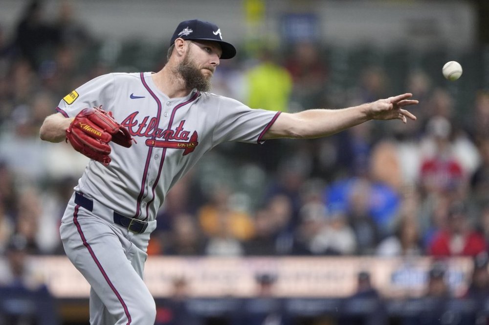 Atlanta Braves' Chris Sale throws to first base during the first inning of a baseball game against the Milwaukee Brewers, Monday, June 9, 2025, in Milwaukee. (AP Photo/Aaron Gash)