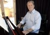 FILE - Musician Brian Wilson poses for a portrait at his home in Los Angeles on July 28, 2008. (AP Photo/Matt Sayles, File)