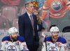 Edmonton Oilers head coach Kris Knoblauch looks on from the bench with Leon Draisaitl (29) and Connor McDavid (97) during the third period in Game 3 of the Stanley Cup final against the Florida Panthers in Sunrise, Fla., on Monday, June 9, 2025. THE CANADIAN PRESS/Nathan Denette