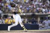 San Diego Padres' Fernando Tatis Jr. hits an RBI double during the fourth inning of a baseball game against the Texas Rangers, Sunday, July 6, 2025, in San Diego. (AP Photo/Orlando Ramirez)