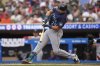 Seattle Mariners' Cal Raleigh (29) hits an RBI-single during the third inning of a baseball game against the Minnesota Twins, Tuesday, June 24, 2025, in Minneapolis. (AP Photo/Abbie Parr)
