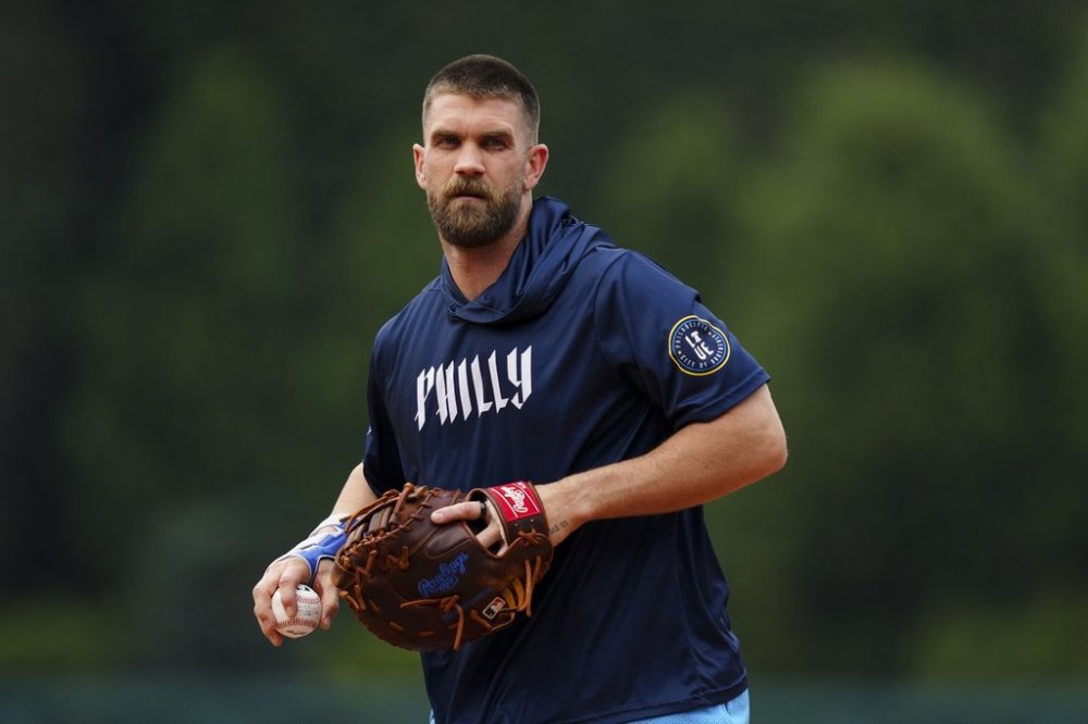 Philadelphia Phillies' Bryce Harper fields ground balls prior to a baseball game against the Toronto Blue Jays, Friday, June 13, 2025, in Philadelphia. (AP Photo/Derik Hamilton)