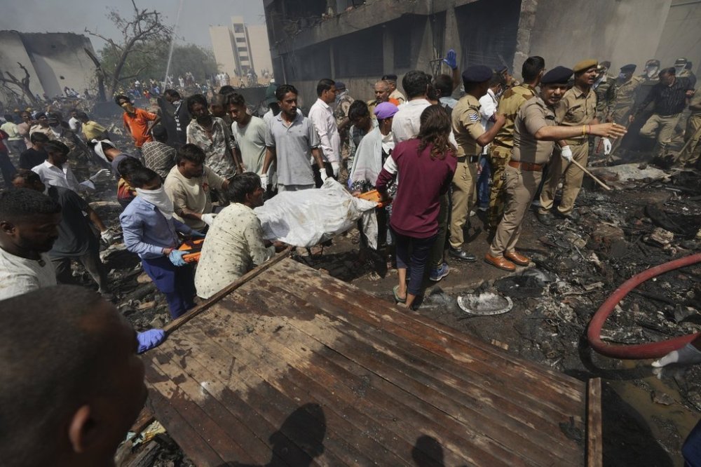 Rescuers work at the site of an airplane that crashed in India's northwestern city of Ahmedabad in Gujarat state, Thursday, June 12, 2025. (AP Photo/Ajit Solanki)