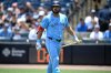 FILE - Toronto Blue Jays' Anthony Santander walks back to the dugout after striking out during the first inning of a baseball game against the Tampa Bay Rays, May 25, 2025, in Tampa, Fla. (AP Photo/Phelan M. Ebenhack, File)