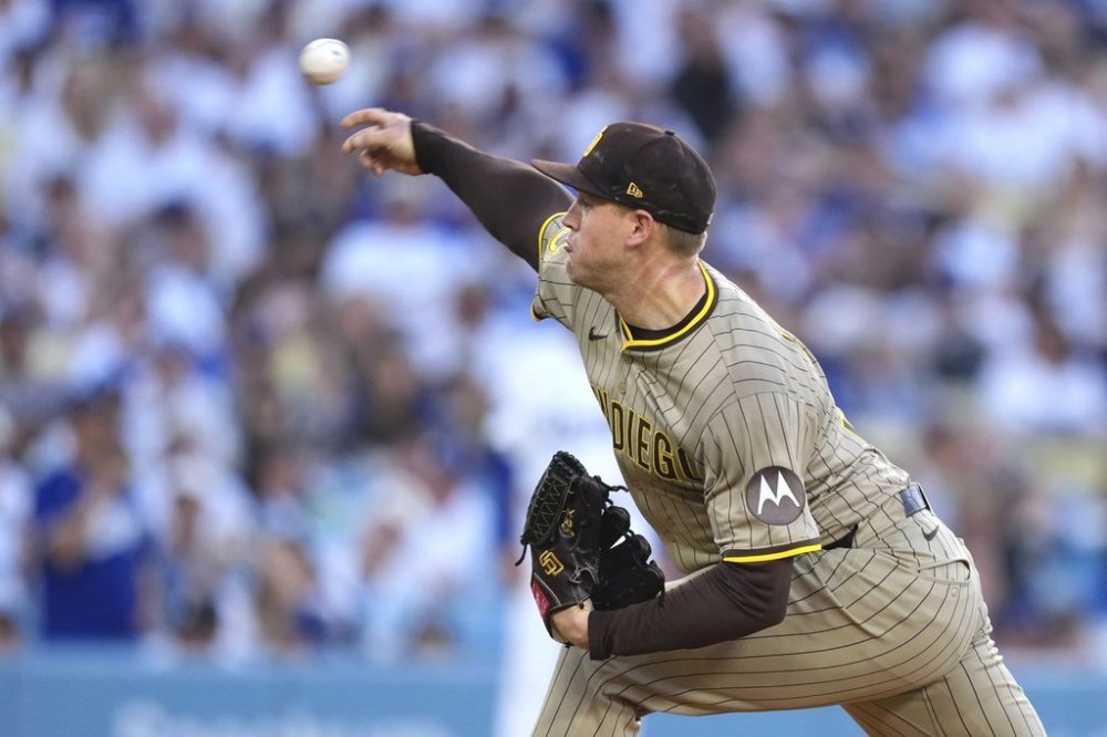 San Diego Padres starting pitcher Stephen Kolek throws to the plate during the first inning of a baseball game against the Los Angeles Dodgers, Wednesday, June 18, 2025, in Los Angeles. (AP Photo/Mark J. Terrill)