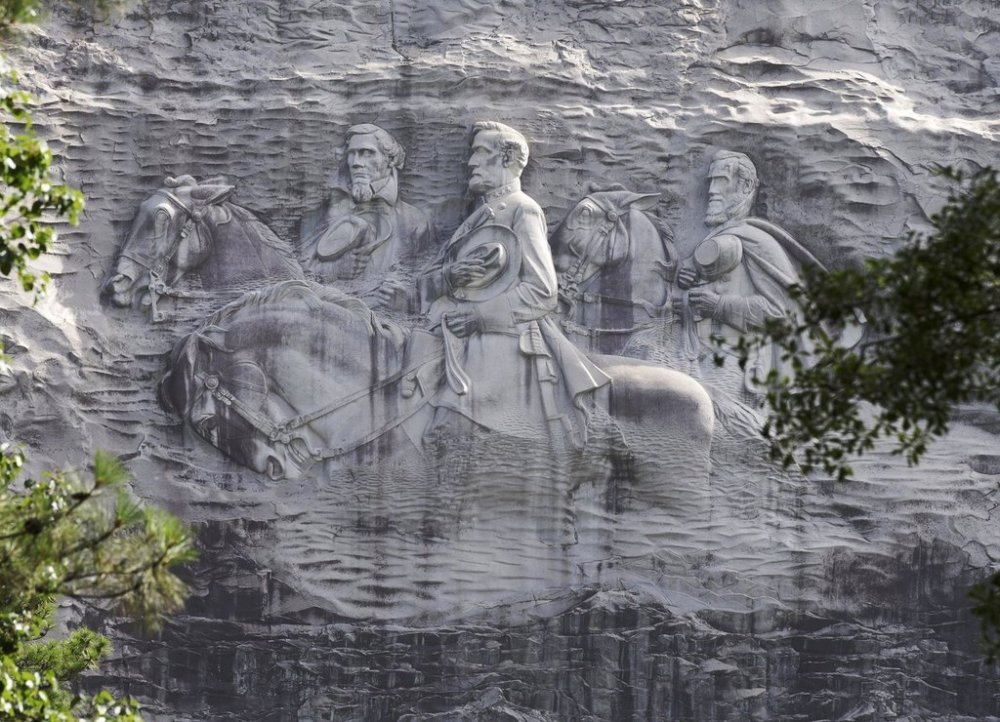 FILE - A carving depicting Confederate Civil War figures Stonewall Jackson, Robert E. Lee and Jefferson Davis, is seen in Stone Mountain, Ga., June 23, 2015. (AP Photo/John Bazemore, File)