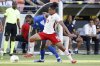 Canada's Nathan Saliba (19) pushes off Curacao's Jürgen Locadia, left, as he moves the ball during a CONCACAF Gold Cup soccer match Saturday, June 21, 2025, in Houston, Texas. THE CANADIAN PRESS/AP, Michael Wyke