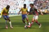 Fluminense's Agustin Canobbio, right, dribbles the ball past Mamelodi Sundowns' Khuliso Mudau, left, and Jayden Adams during the Club World Cup Group F soccer match between Mamelodi Sundowns and Fluminense in Miami Gardens, Fla., Wednesday, June 25, 2025. (AP Photo/Lynne Sladky)