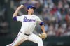 Texas Rangers pitcher Jacob deGrom throws a pitch to the Baltimore Orioles during the first inning of a baseball game Tuesday, July 1, 2025, in Arlington, Texas. (AP Photo/Julio Cortez)