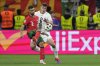 FILE - Slovenia's Jaka Bijol, right, and Portugal's Bruno Fernandes in action during a round of sixteen match at the Euro 2024 soccer tournament in Frankfurt, Germany, July 1, 2024. (AP Photo/Antonio Calanni, File)
