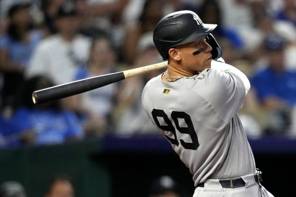 New York Yankees' Aaron Judge hits a home run in the seventh inning during a baseball game against the Kansas City Royals, Wednesday, June 11, 2025, in Kansas City, Mo. (AP Photo/Ed Zurga)