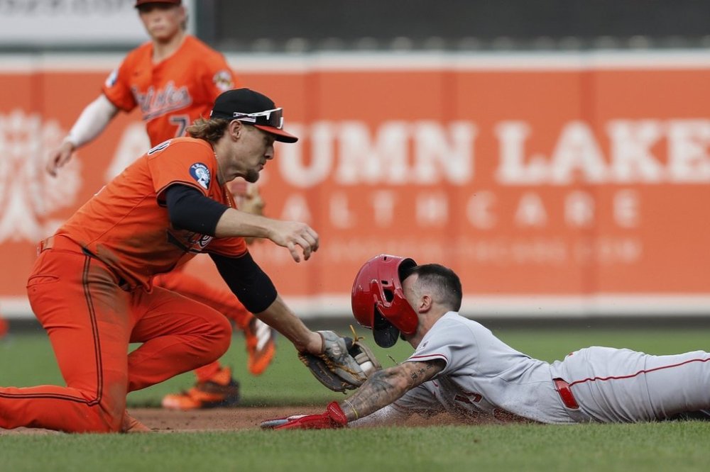 Los Angeles Angels' Zach Neto attempts to steal second base and is tagged out by Baltimore Orioles shortstop Gunnar Henderson during the eighth inning of a baseball game in Baltimore, Saturday, June 14, 2025. (AP Photo/Terrance Williams)