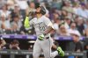 Chicago White Sox's Lenyn Sosa gestures as he circles the bases after hitting a two-run home run off Colorado Rockies starting pitcher Germán Márquez in the second inning of a baseball game Saturday, July 5, 2025, in Denver. (AP Photo/David Zalubowski)
