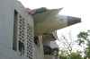 The debris of an airplane sticks out of a building after it crashed in India's northwestern city of Ahmedabad in Gujarat state, Thursday, June 12, 2025. (AP Photo/Ajit Solanki)