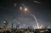 Israeli Iron Dome air defense system fires to intercept missiles over Tel Aviv, Israel, Friday, June 13, 2025. (AP Photo/Leo Correa)