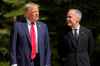 Canada's Prime Minister Mark Carney, right, greets President Donald Trump during the official welcome of the G7 Summit, Monday, June 16, 2025, in Kananaskis, Canada. (AP Photo/Mark Schiefelbein)
