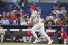 Philadelphia Phillies' Trea Turner watches after hitting a solo home run during the first inning of a baseball game against the Miami Marlins, Monday, June 16, 2025, in Miami. (AP Photo/Lynne Sladky)