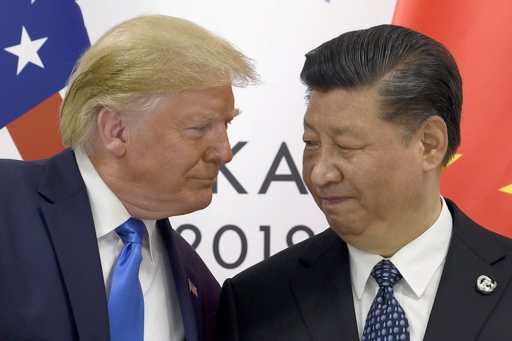 FILE - President Donald Trump, left, meets with Chinese President Xi Jinping during a meeting on the sidelines of the G-20 summit in Osaka, Japan, June 29, 2019. (AP Photo/Susan Walsh, File)