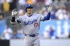 Los Angeles Dodgers' Shohei Ohtani (17) celebrates after hitting a double against the San Diego Padres during the first inning of a baseball game Monday, June 9, 2025, in San Diego. (AP Photo/Orlando Ramirez)