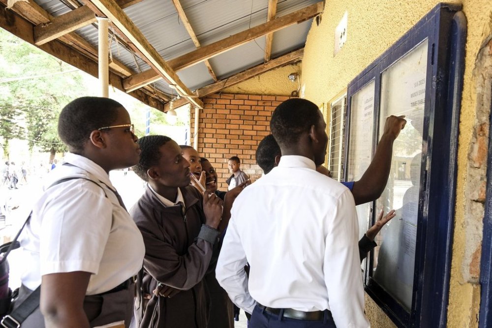 Students look on the notice board at Uganda Martyrs' Secondary School Namugongo, in Kampala, Uganda Monday, May 26, 2025. (AP Photo/Hajarah Nalwadda)