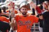 Baltimore Orioles' Colton Cowser high-fives teammates in the dugout after hitting a two-run home run in the fourth inning of a baseball game against the Atlanta Braves, Saturday, July 5, 2025, in Atlanta. (AP Photo/Colin Hubbard)