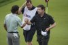 Robert MacIntyre, of Scotland, and Cameron Young, left, shake hands after finishing the final round of the U.S. Open golf tournament at Oakmont Country Club Sunday, June 15, 2025, in Oakmont, Pa. (AP Photo/Gene J. Puskar)