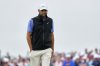 Scottie Scheffler reacts to a putt on the 18th hole during the final round of the U.S. Open golf tournament at Oakmont Country Club Sunday, June 15, 2025, in Oakmont, Pa. (AP Photo/Carolyn Kaster)