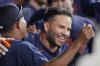 Houston Astros' Jose Altuve celebrates in the dugout after hitting a two-run home run against the Chicago Cubs during the fifth inning of a baseball game Sunday, June 29, 2025, in Houston. (AP Photo/David J. Phillip)