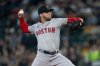 FILE - Boston Red Sox starter Kutter Crawford delivers a pitch against the Seattle Mariners during a baseball game, Saturday, March 30, 2024, in Seattle. (AP Photo/Stephen Brashear, File)