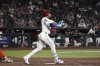Arizona Diamondbacks' Ketel Marte hits a two-run home run against the San Francisco Giants in the ninth inning during a baseball game, Wednesday, July 2, 2025, in Phoenix. (AP Photo/Rick Scuteri)