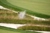 Scottie Scheffler plays out of the Church Pews bunker on the third hole during the second round of the U.S. Open golf tournament at Oakmont Country Club Friday, June 13, 2025, in Oakmont, Pa. (AP Photo/Charlie Riedel)