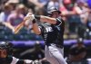 Chicago White Sox's Colson Montgomery singles against Colorado Rockies starting pitcher Chase Dollander in the second inning of a baseball game Sunday, July 6, 2025, in Denver. (AP Photo/David Zalubowski)