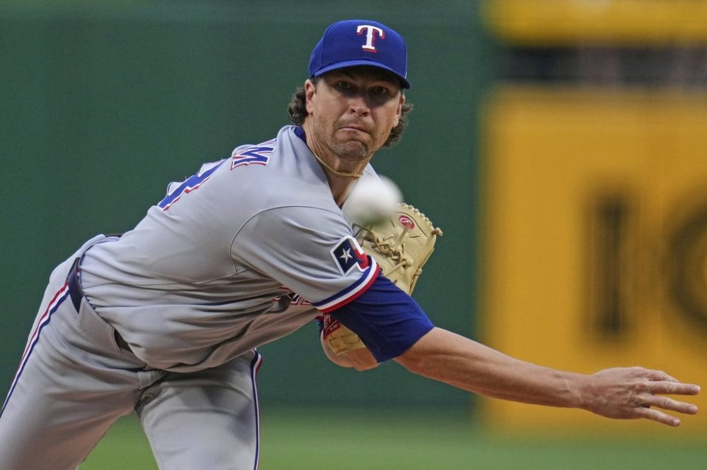Texas Rangers pitcher Jacob deGrom delivers during the first inning of a baseball game against the Pittsburgh Pirates in Pittsburgh, Friday, June 20, 2025. (AP Photo/Gene J. Puskar)