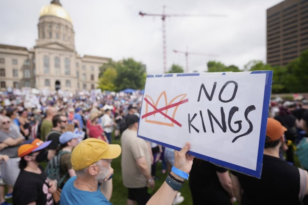 A demonstrator holds a sign during a
