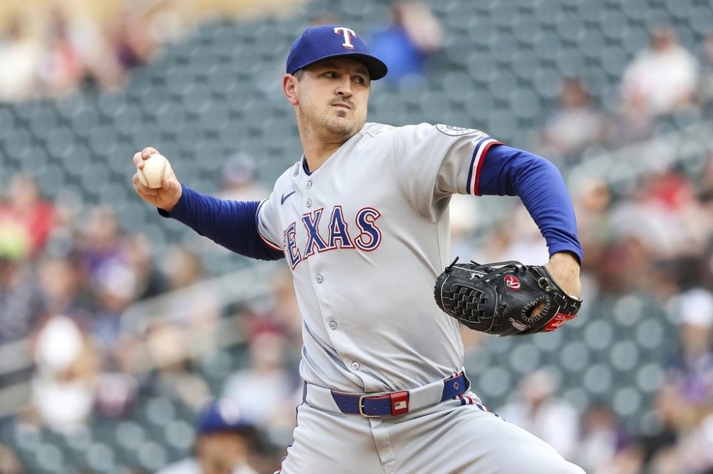 Texas Rangers starting pitcher Tyler Mahle (51) delivers against the Minnesota Twins during the first inning of baseball game Tuesday, June 10, 2025, in Minneapolis. (AP Photo/Matt Krohn)