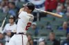Atlanta Braves first baseman Matt Olson (28) hits a double against the Los Angeles Angels in the third inning of a baseball game, Wednesday, July 2, 2025, in Atlanta. (AP Photo/Mike Stewart)