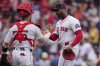 Boston Red Sox pitcher Aroldis Chapman, right, is congratulated by catcher Carlos Narváez (75) after defeating the Cincinnati Reds following the ninth inning of a baseball game, a continuation of a game the night before which was suspended due to rain, Wednesday, July 2, 2025, at Fenway Park, in Boston. (AP Photo/Charles Krupa)