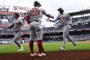 Boston Red Sox's Trevor Story, right, celebrates after his two-run home run with Abraham Toro (29) during the first inning of a baseball game against the Washington Nationals, Sunday, July 6, 2025, in Washington. (AP Photo/Nick Wass)