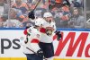 Florida Panthers' Anton Lundell (15) and Brad Marchand (63) celebrate a goal against the Edmonton Oilers during third period of Game 5 of the NHL Stanley Cup final in Edmonton, Saturday, June 14, 2025. THE CANADIAN PRESS/Jason Franson