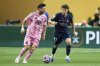 Inter Miami's Lionel Messi, left, and Paris Saint-Germain's Joao Neves compete for the ball during the Club World Cup round of 16 soccer match between PSG and Inter Miami in Atlanta, Sunday, June 29, 2025. (AP Photo/Brynn Anderson)