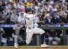 Seattle Mariners' Ben Williamson hits a RBI-double during the sixth inning of a baseball game against the Pittsburgh Pirates, Saturday, July 5, 2025, in Seattle. (AP Photo/Stephen Brashear)