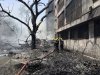 Firefighters work at the site of an airplane that crashed in India's northwestern city of Ahmedabad in Gujarat state, Thursday, June12, 2025. (AP Photo/Ajit Solanki)