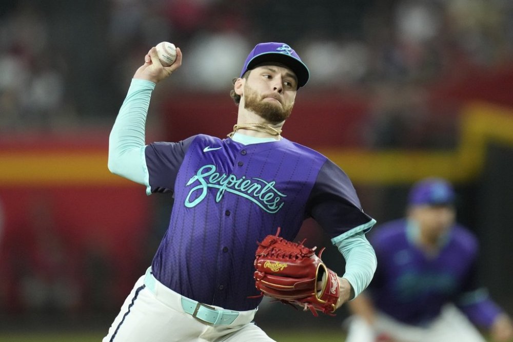 Arizona Diamondbacks starting pitcher Ryne Nelson throws against the Kansas City Royals during the first inning of a baseball game Saturday, July 5, 2025, in Phoenix. (AP Photo/Ross D. Franklin)