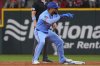 Texas Rangers' Ezequiel Duran, front, stands on second base and reacts after hitting a double that scored teammate Adolis García during the second inning of a baseball game against the Chicago White Sox, Sunday, June 15, 2025, in Arlington, Texas. (AP Photo/LM Otero)