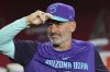 Arizona Diamondbacks manager Torey Lovullo pauses in the dugout prior to a baseball game against the Washington Nationals Friday, May 30, 2025, in Phoenix. (AP Photo/Ross D. Franklin)